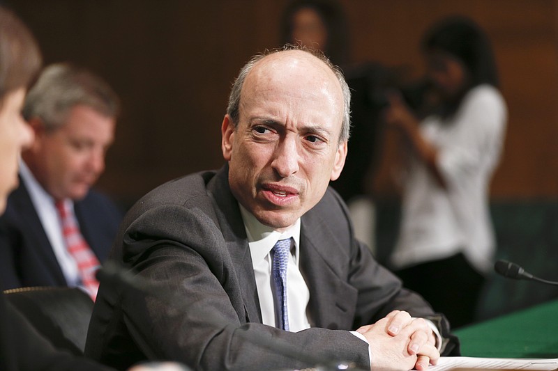 FILE - Commodity Futures Trading Commission (CFTC) Chairman Gary Gensler testifies on Capitol Hill in Washington, July 30, 2013. The chairman of the Securities and Exchange Commission said that investors need more protection in the cryptocurrency market, which he said is “rife with fraud, scams and abuse."  Gary Gensler, appointed by President Joe Biden to lead the body that regulates securities markets, listed several areas where crypto needed to be reigned in or regulated, particularly with regard to money laundering, sanctions, tax collection and extortion via ransomware. (AP Photo/J. Scott Applewhite, file)