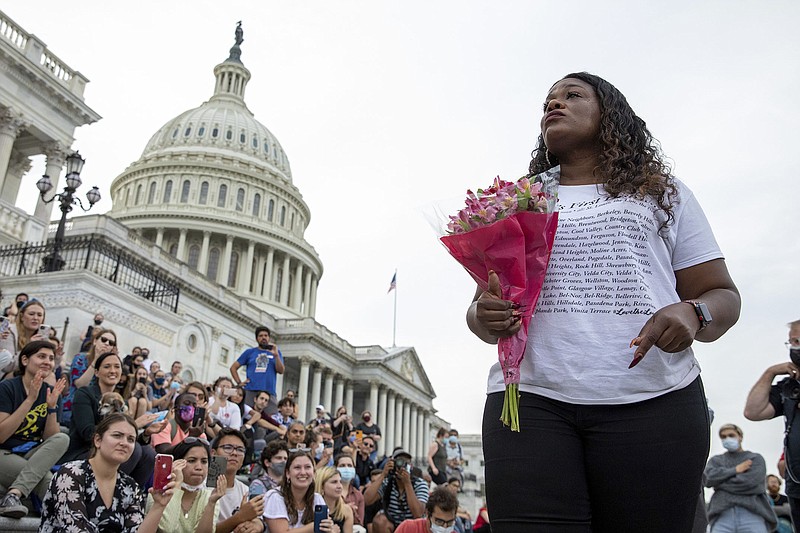 Rep. Cori Bush, D-Mo., speaks to crowds that attended a sit-in at Capitol Hill after it was announced that the Biden administration will enact a targeted nationwide eviction moratorium outside of Capitol Hill in Washington on Tuesday, August 3, 2021. For the past five days, lawmakers and activists primarily led by Rep. Cori Bush, D-Mo., have been sitting in on the steps of Capitol Hill to protest the expiration of the eviction moratorium. (AP Photo/Amanda Andrade-Rhoades)