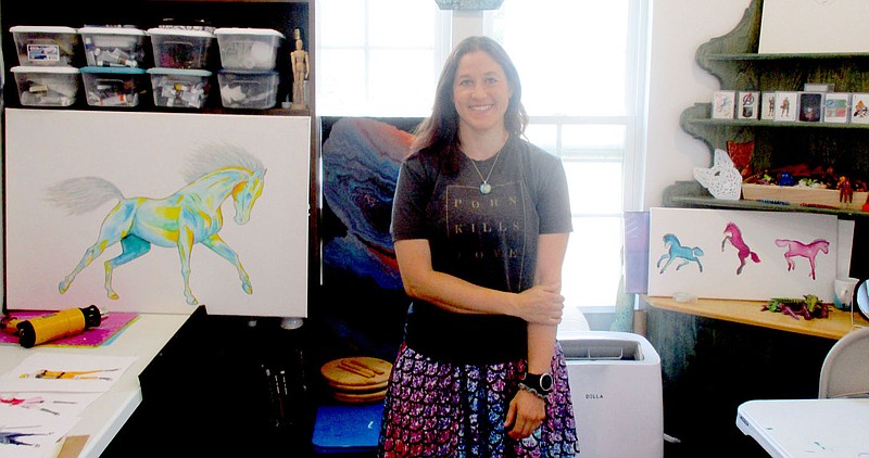 Marc Hayot/Herald-Leader Jessica Thompson proudly displays her work in the studio her father built her. Over the last nine years, Thompson has achieved local fame as an artist of many mediums.