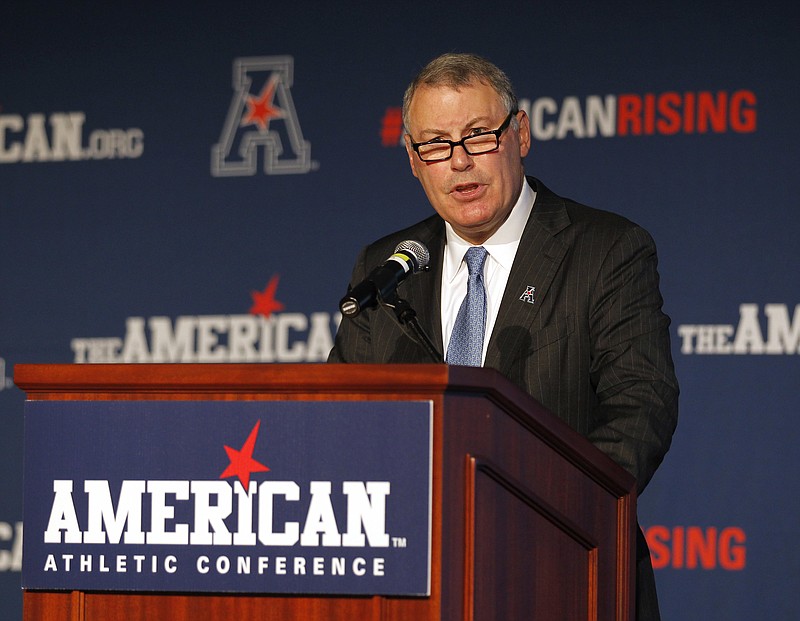 American Athletic Conference Commissioner Mike Aresco addresses the media during an Aug. 4, 2015, NCAA football media day in Newport, R.I. Aresco vehemently denied that his league has ever “plotted” with ESPN to undermine another conference by poaching its schools. Aresco addressed conference realignment Wednesday during the AAC’s virtual football media day, saying the league is not actively looking to add schools. - Photo by Stew Milne of The Associated Press