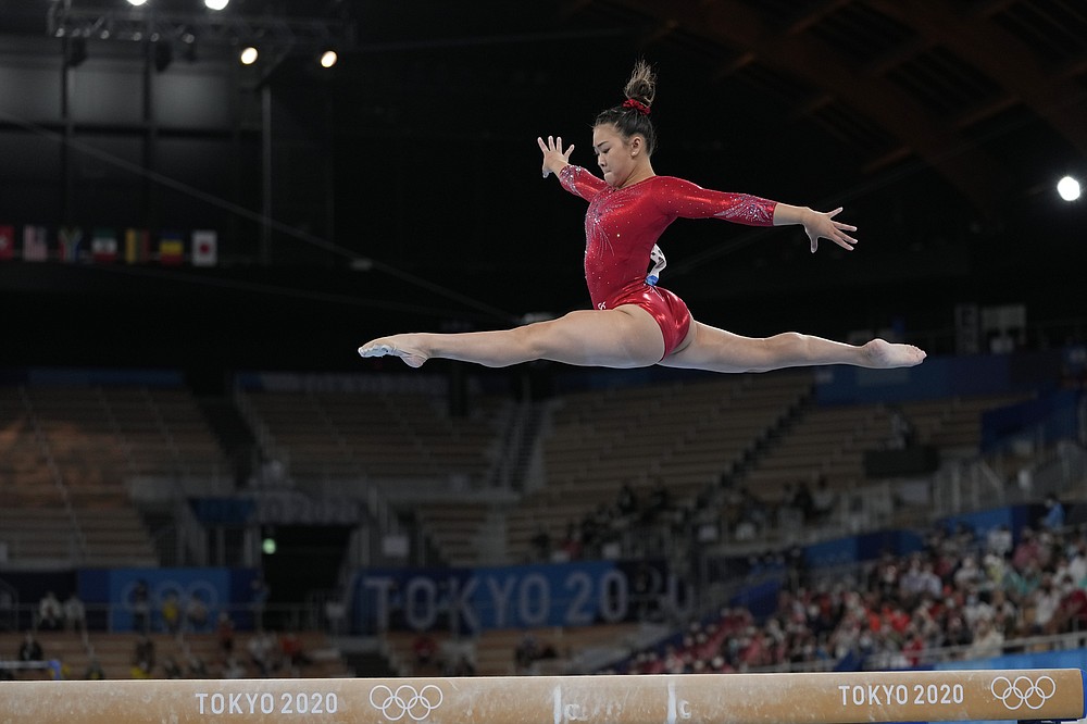 Sunisa Lee, of the United States, performs on the balance beam during the artistic gymnastics women's apparatus final at the 2020 Summer Olympics, Tuesday, Aug. 3, 2021, in Tokyo, Japan. (AP Photo/Ashley Landis)