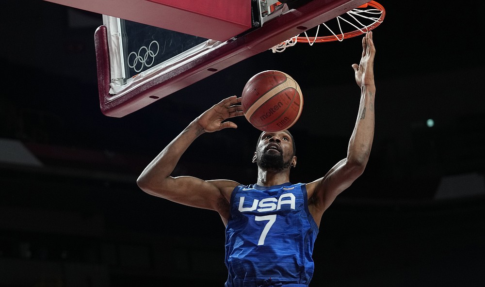 United States' Kevin Durant (7) scores during men's basketball quarterfinal game against Spain at the 2020 Summer Olympics, Tuesday, Aug. 3, 2021, in Saitama, Japan. (AP Photo/Eric Gay)