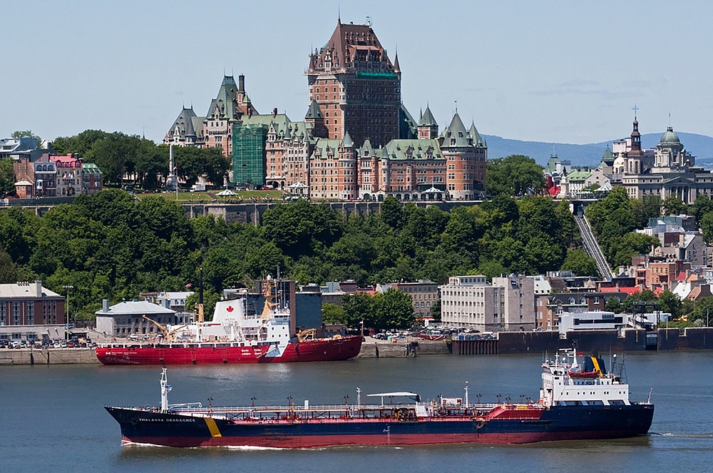 In this June 14, 2012 photo, the ship that would later become the Asphalt Princess sails through Quebec City, Canada. The hijackers who captured the Asphalt Princess off the coast of the United Arab Emirates in the Gulf of Oman departed the targeted ship on Wednesday, Aug. 4, 2021, the British navy reported, as recorded radio traffic appeared to reveal a crew member onboard saying Iranian gunmen had stormed the asphalt tanker. (Steve Geronazzo via AP)