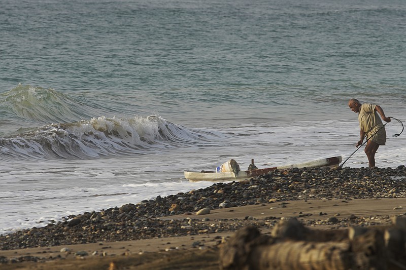 A fisherman brings his boat in after casting his nets in Fujairah, United Arab Emirates, Wednesday, Aug. 4, 2021. The British navy warned of a &quot;potential hijack&quot; of another ship off the coast of the United Arab Emirates in the Gulf of Oman near Fujairah on Tuesday, though the circumstances remain unclear. (AP Photo/Jon Gambrell)