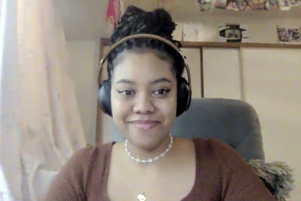 In this image made from video, Melissa Luna Isomoto, a college student, attends a video interview from her home in Yokohama, near Tokyo, on July 31, 2021. The population of people with multiracial and cultural backgrounds continues to rise through more international marriages and an influx of foreign workers, but tolerance to diversity still lags in a country that values homogeneity and conformity. (AP Photo)