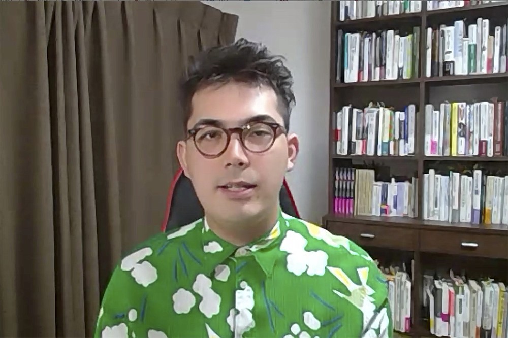In this image made from video, Julian Keane, sociologist at the Urban-Culture Research Center of Osaka City University, speaks during a video interview from Osaka, western Japan, on July 27, 2021. The racial diversity Japan showcased at the Olympic opening ceremony also highlights its lack in Japanese society. The population of people with multiracial and cultural backgrounds continues to rise through more international marriages and an influx of foreign workers, but tolerance to diversity still lags in a country that values homogeneity and conformity. (AP Photo)