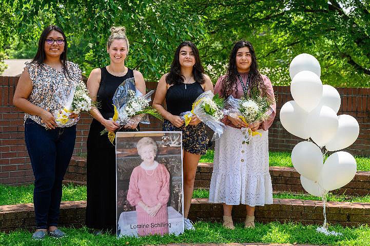 The P.E.O. Chapter U of Rogers has awarded nine women $7,000 from the Loraine Schilling Fund Scholarship for the upcoming 2021-22 academic year. Pictured with a poster of the founder, Loraine Shilling, are this year’s scholars, Yullyana Laguna (from left), Ashleigh Severson, Haley Trejo and Noami Salazar. Not pictured are recipients Azucena Carbajal, Raeli Chesser, Debbie Dang, Andrea Gomez and Hai Lam (Kylie) Huynh. In the 10 years since its inception, the P.E.O. Chapter, University of Arkansas, Loraine Schilling Fund Scholarship has awarded $24,500 in scholarships to 19 women.
(Courtesy photo)