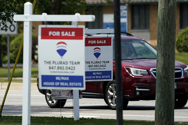 &quot;For Sale&quot; signs are seen outside a home in Glenview, Ill., Tuesday, July 27, 2021.  Mortgage rates were flat to lower last week, Aug. 5, with the average for the key 30-year home loan below 3% for the sixth straight week.    (AP Photo/Nam Y. Huh)