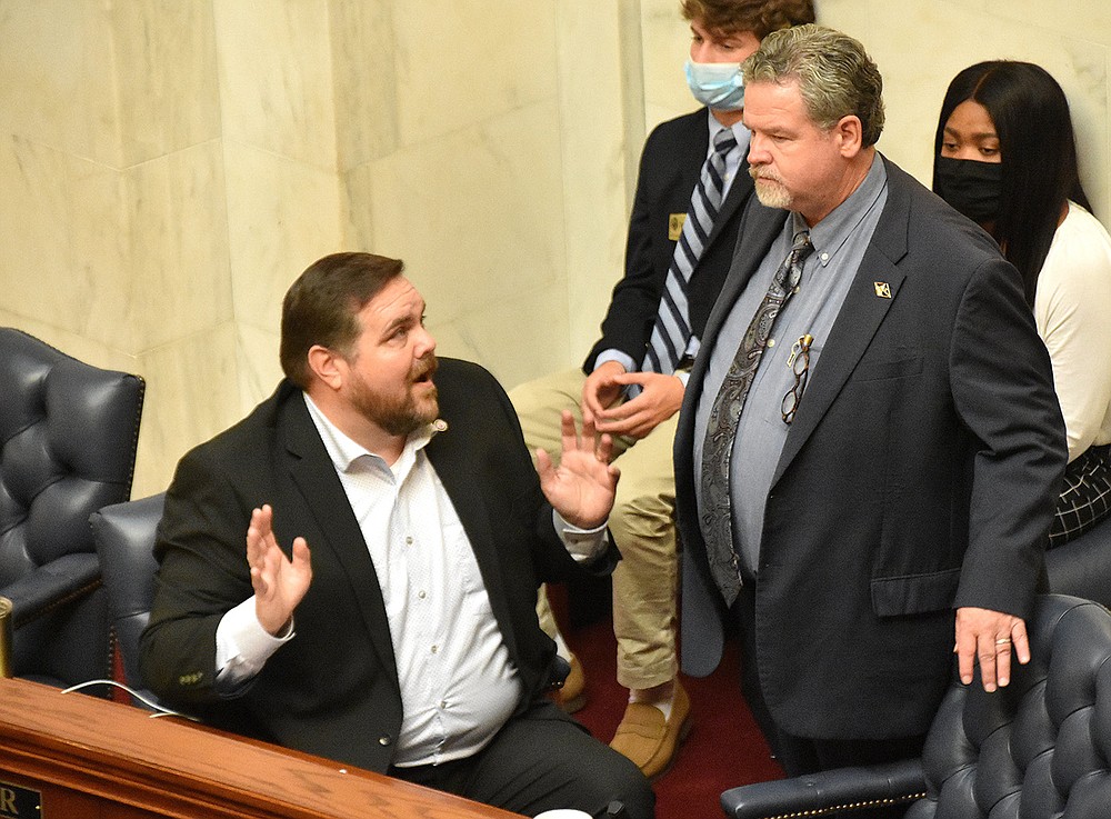 Sen. Bob Ballinger (left), R-Ozark, talks with Sen. Alan Clark, R-Lonsdale, during the Senate session on Thursday.
(Arkansas Democrat-Gazette/Staci Vandagriff)