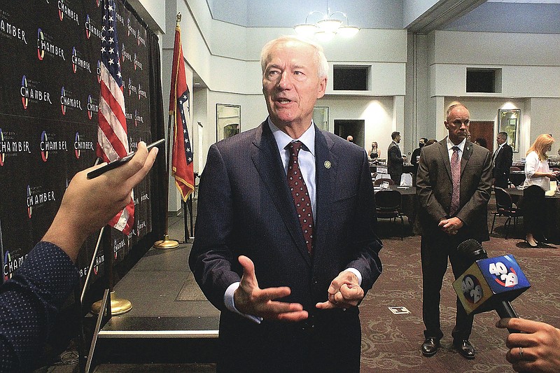 Arkansas Gov. Asa Hutchinson speaks to the media following an address at the Fort Smith Regional Chamber of Commerce First Friday Breakfast on Friday, Aug. 6, 2021, at the University of Arkansas Fort Smith.