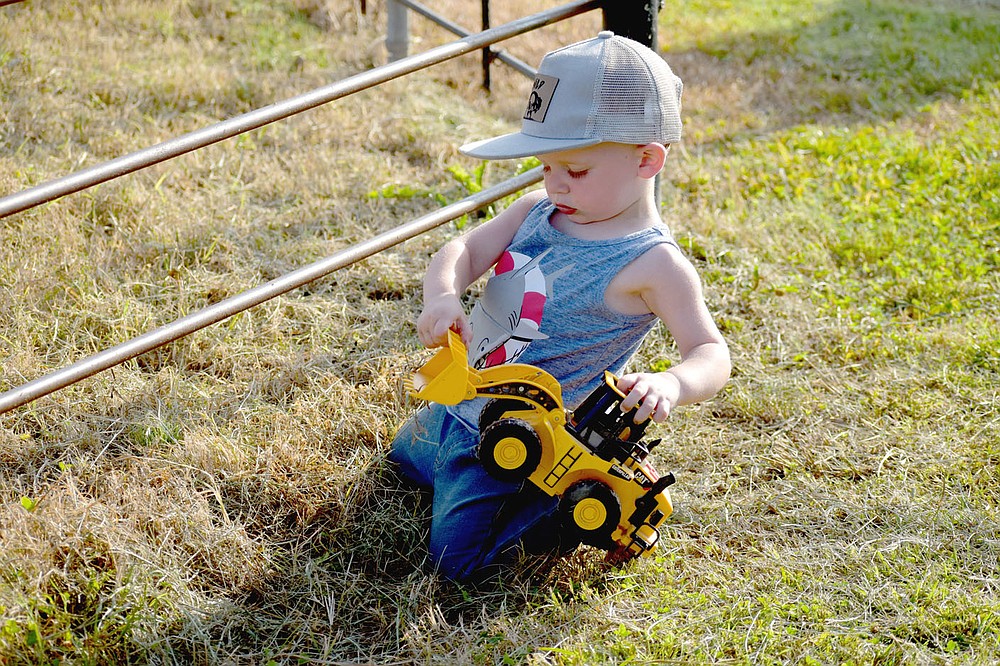 MARK HUMPHREY ENTERPRISE-LEADER/Abbott Pitts, son of Seth and Alyssa Pitts,
entertains himself during a recent Lincoln Riding Club Play Day. This week's 68th annual Lincoln Rodeo is a family friendly event featuring rodeo performances Thursday through Friday at the LRC Arena one mile west of town on U.S. 62 plus a bunch of other rodeo related activities including Wednesday's street dance on the Lincoln Square downtown and the 2021 royalty pageant ongoing throughout the week.