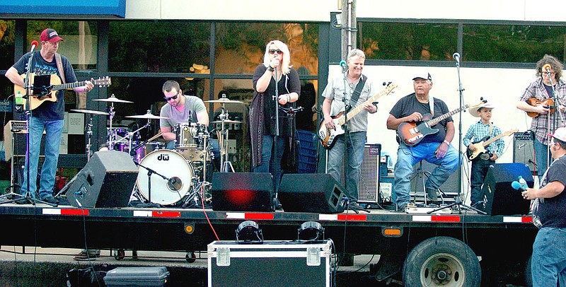 MARK HUMPHREY ENTERPRISE-LEADER/Covid interrupted one of the longest running gigs in the music business last year with cancellation of the Lincoln Rodeo street dance played annually by the Boston Mountain Playboys. The band lineup (from left): Jimmy Fields, guitar/vocals; Tyler Bottje, drums; Heather Replogle Keenen, vocalist; Howard Lester, guitar/vocals; Chris Lynch, bass/vocals; and Stacy Pixley, fiddle was joined on stage by Lester's grandson, Braxton Blankenship (second from right), in this photo. The band played together for many years until Lester's passing on Aug. 13, 2020.