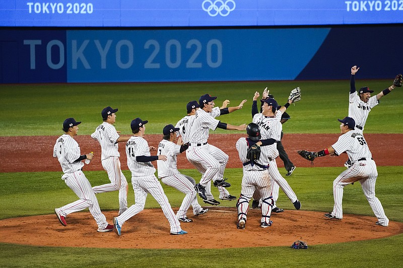 Team Japan celebrate after the gold medal baseball game against the United States at the 2020 Summer Olympics, Saturday, Aug. 7, 2021, in Yokohama, Japan. Japan won 2-0. (AP Photo/Jae C. Hong)