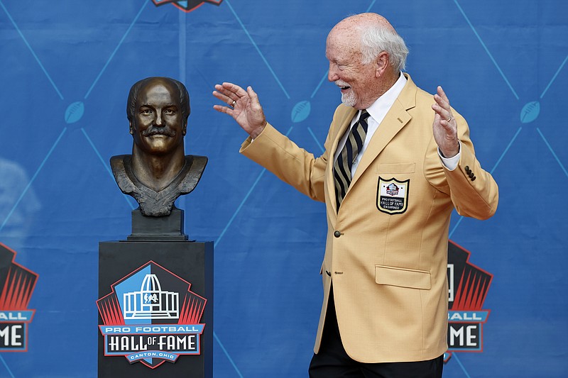 Cliff Harris, a member of the Pro Football Hall of Fame Centennial Class, reacts during the induction ceremony at the Pro Football Hall of Fame, Saturday, Aug. 7, 2021, in Canton, Ohio. (AP Photo/Ron Schwane, Pool)