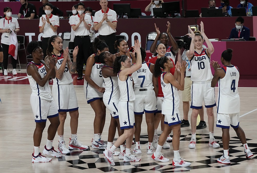 United States players celebrate their win in the women's basketball gold medal game against Japan at the 2020 Summer Olympics, Sunday, Aug. 8, 2021, in Saitama, Japan. (AP Photo/Luca Bruno)