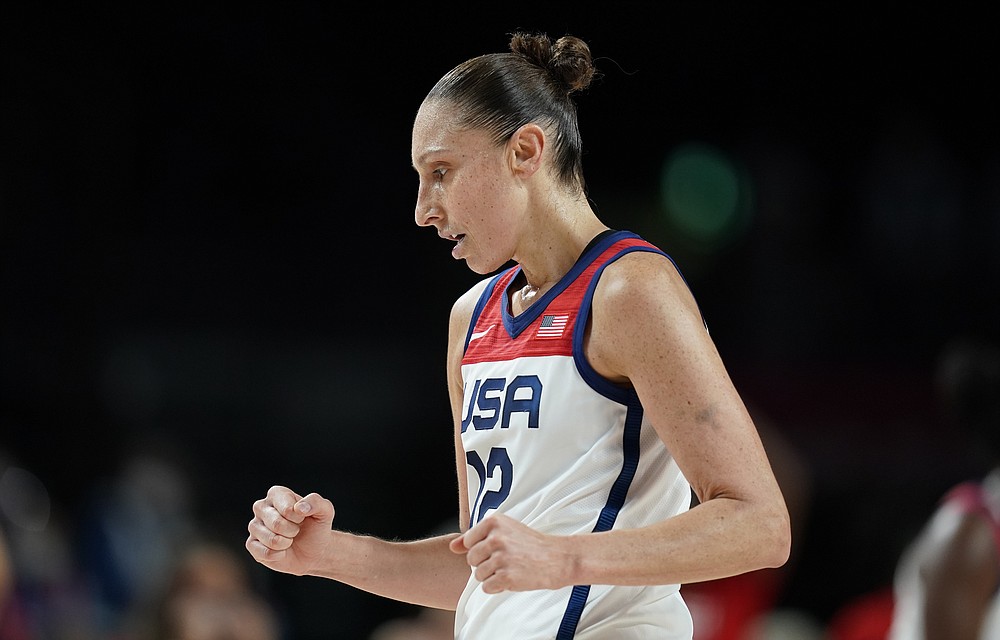 United States' Diana Taurasi (12) celebrates during women's basketball gold medal game against Japan at the 2020 Summer Olympics, Sunday, Aug. 8, 2021, in Saitama, Japan. (AP Photo/Charlie Neibergall)