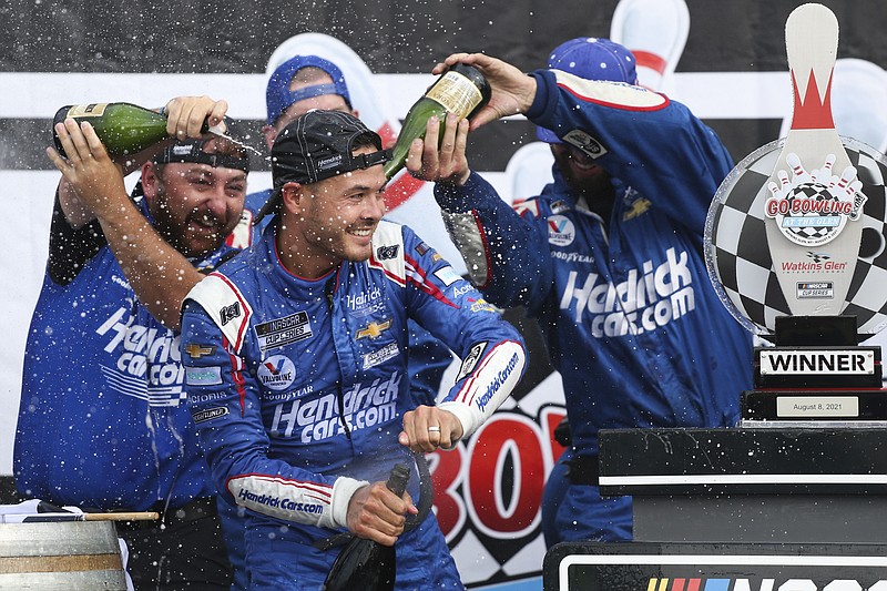 Kyle Larson, center, celebrates with his pit crew after winning Sunday's NASCAR Cup Series race in Watkins Glen, N.Y. - Photo by Joshua Bessex of The Associated Press