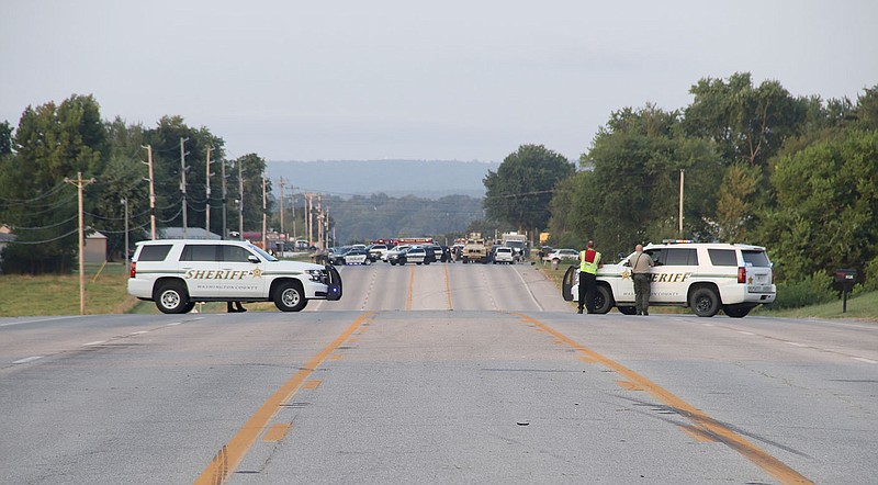 LYNN KUTTER ENTERPRISE-LEADER
Police blocked traffic for part of U.S. Highway 62 from about 3 a.m. to 7:30 a.m. Monday because of a standoff with a suspect following a pursuit that started in Fayetteville and ended near the Farmers Cooperative. The suspect has been taken into custody.