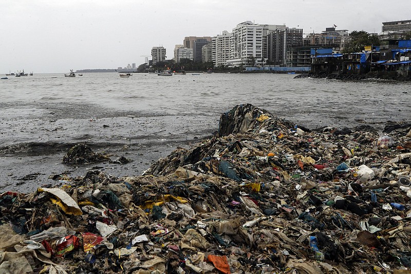 Plastic and other trash that got washed ashore on the Arabian Sea coast in Mumbai, India, Monday, Aug. 9, 2021. Earth?s climate is getting so hot that temperatures in about a decade will probably blow past a level of warming that world leaders have sought to prevent, according to a report released Monday that the United Nations called a ?code red for humanity.? (AP Photo/Rajanish Kakade)