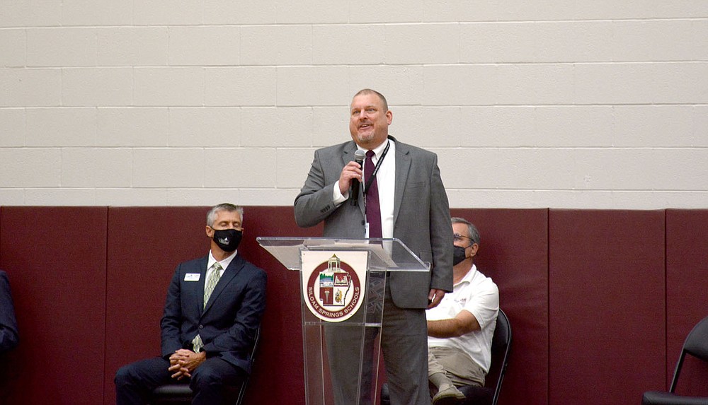 Marc Hayot/Siloam Sunday Siloam Springs Superintendent Jody Wiggins addresses the crowd of district employees and chamber ambassadors at the Back to School Breakfast on Wednesday at the high school.