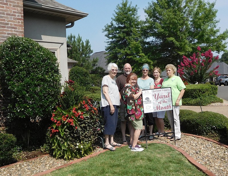 From left are Master Gardeners Barbara Gaunt and Lin Johnson, homeowners Sam and Kim Vallery, and Master Gardeners Sunshine Spielvogle and Carolyn Davis. Not pictured is Master Gardener Jennetta Sanders. - Submitted photo