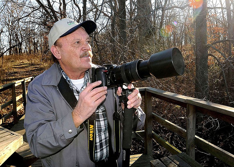 Terry Stanfill photographs bald eagles at Swepco Lake in 2016. His outstanding nature photos have appeared in the Northwest Arkansas Democrat-Gazette for years. Stanfill died on Aug. 7.
(NWA Democrat-Gazette/Flip Putthoff)