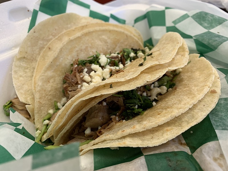 Rock City Taco on East Third Street makes its tacos with smoked meat. Our three pork tacos also came with rice and beans. (Arkansas Democrat-Gazette/Eric E. Harrison)