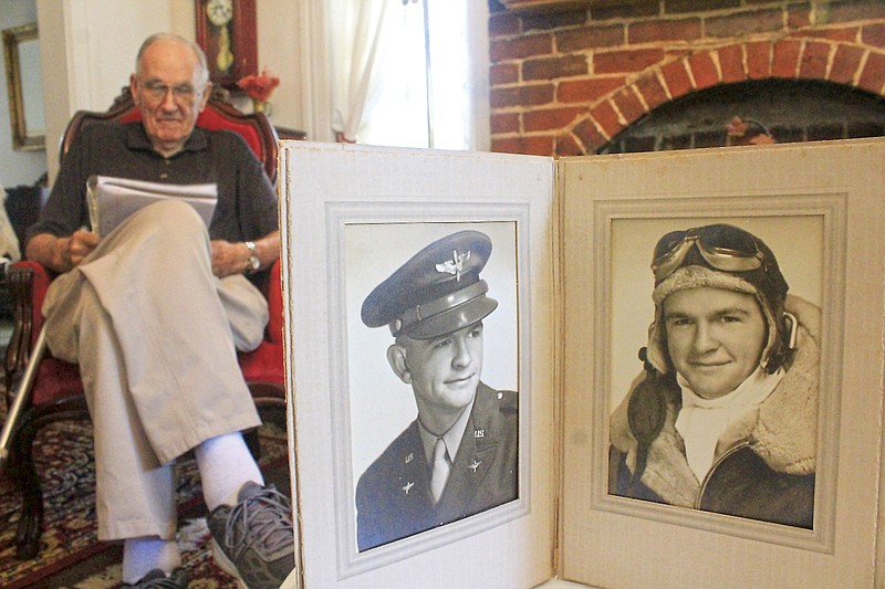 Photos of late World War II airman Henry Mitchell are displayed Wednesday in Bob Mitchell's home on Aug. 11, 2021, in Fort Smith.
(NWA Democrat-Gazette/Max Bryan)