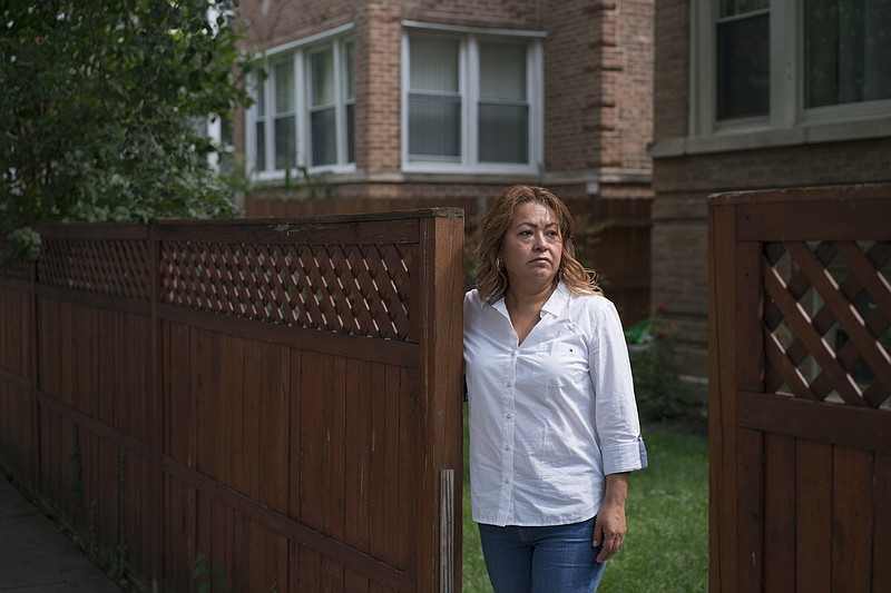 Julianna Hernandez at her home in Chicago. Her income has fallen from tenants who can't or won't pay, and her debts are mounting. MUST CREDIT: Photo by Youngrae Kim for The Washington Post.