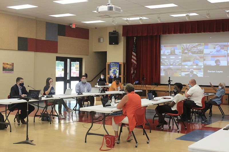 The Fort Smith School Board is seen Thursday, Aug. 12, 2021, in the auditorium of Sutton Elementary School.