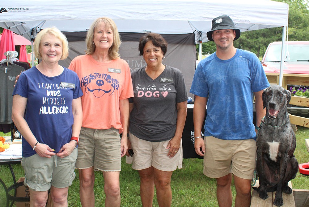 Desi Keel (from left), Carla Hodges, Alison Kimbrough, Humane Society of the Ozarks board members; Chase Jackson, executive director; and Tusk welcome guests to Dog Days of Summer on Aug. 1.
(NWA Democrat-Gazette/Carin Schoppmeyer)