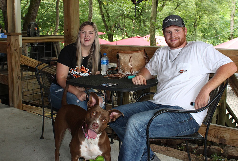Katie Harms and Kole Fairchild, with Savi, enjoy the Dog Days of Summer.
(NWA Democrat-Gazette/Carin Schoppmeyer)