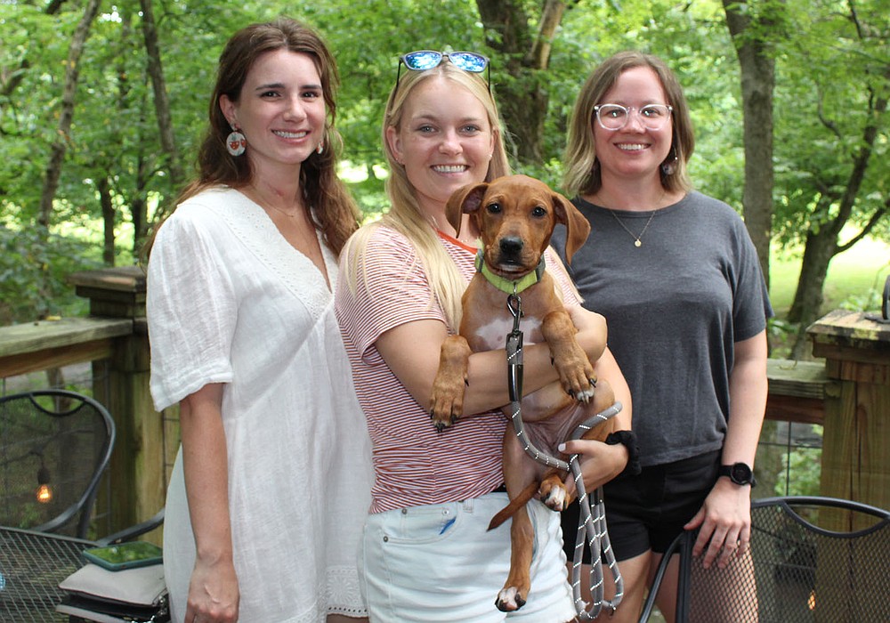 Megan Wein (from left), Laine Zammit, Hatch and Lacey Garrison help support the Humane Society of the Ozarks on Aug. 1.
(NWA Democrat-Gazette/Carin Schoppmeyer)