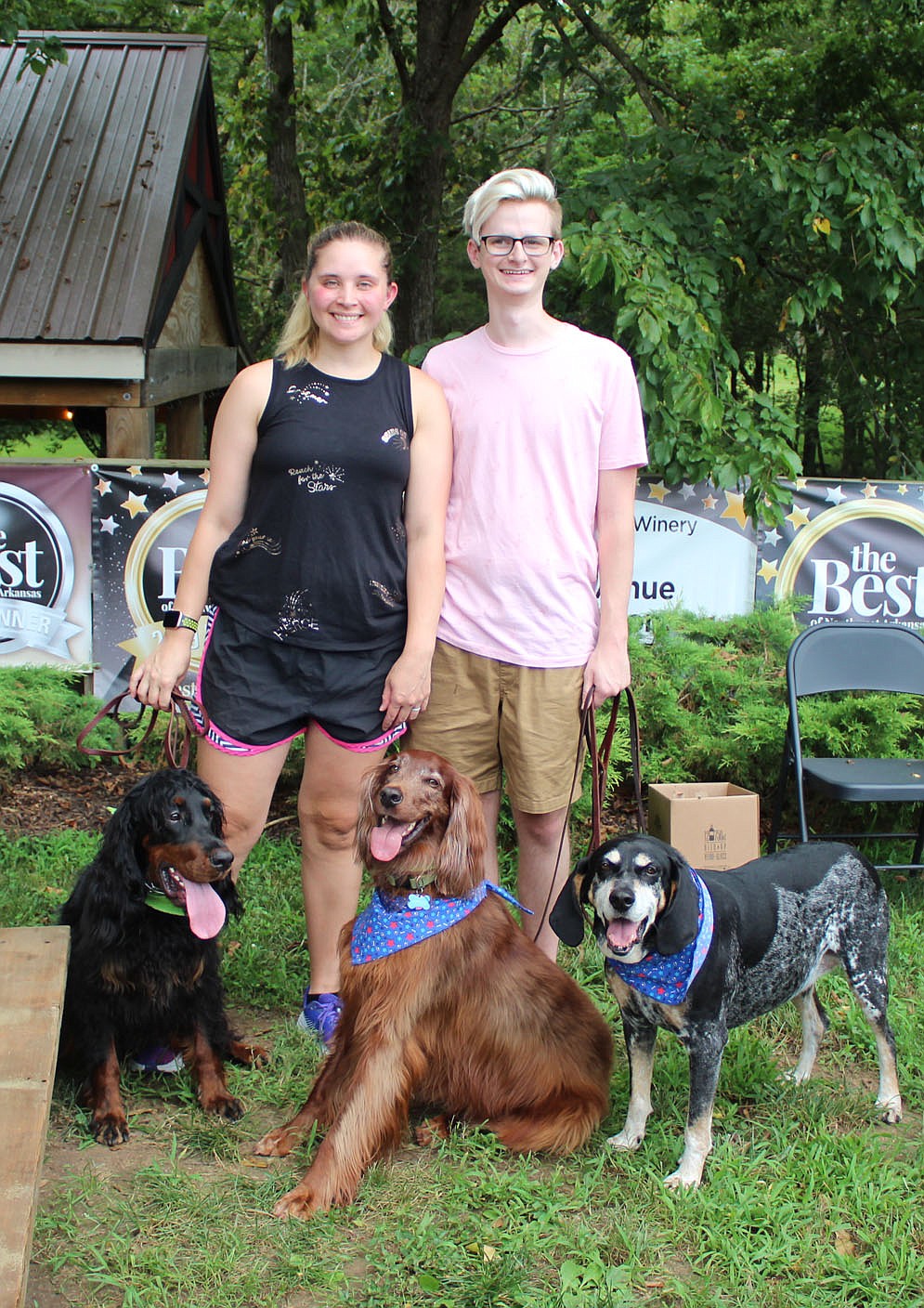 Kara and Brad Nickell help support the Humane Society with Ruby (from left), Arthur and Handsome on Aug. 1.
(NWA Democrat-Gazette/Carin Schoppmeyer)
