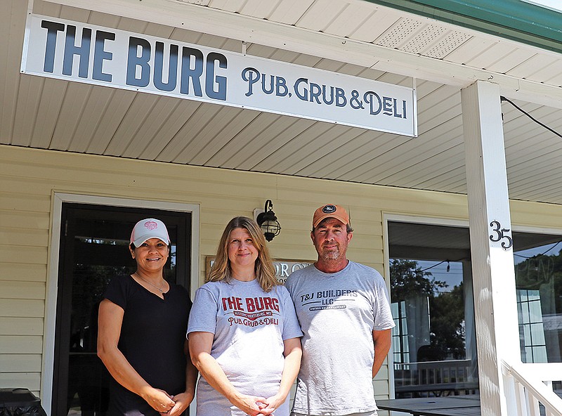 Jason Strickland/News Tribune - Cindy Nilges, manager, from left, Kathy and Jay Leffert, owners, stand in front of the The Burg, a new business in Hartsburg. The business plans to serve as food and beverages for both local residents and cyclists on the Katy Trail.