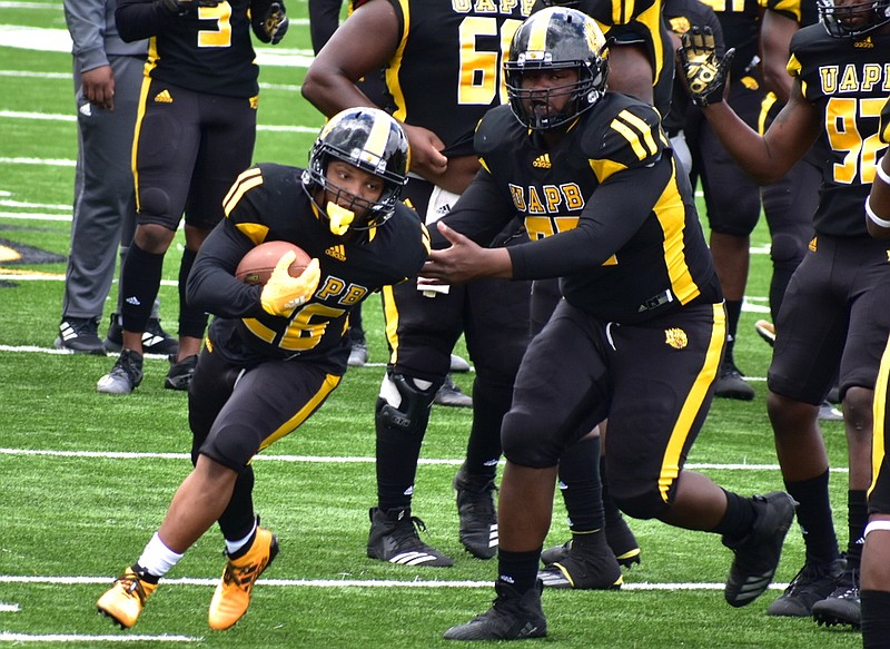 UAPB running back Omar Allen Jr. takes a handoff during warm-ups before an April 17 home game against Prairie View A&M. (Pine Bluff Commercial/I.C. Murrell)