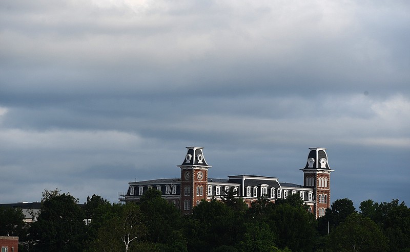 FILE -- In this May 25, 2020, file photo, Old Main at the University of Arkansas is lit by the rising sun after storms rolled through the area. (NWA Democrat-Gazette/J.T.WAMPLER)