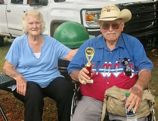 Westside Eagle Observer/SUSAN HOLLAND
Frances and Al Radley, of Farmington, won the trophy for oldest persons attending Gravette Day. Frances and Al are both 83. They were enjoying the opening ceremony in the park with their daughter who lives in Gravette.