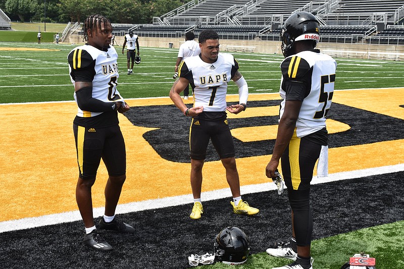 From left, UAPB rover Jalen Thigpen, wide receiver Tyrin Ralph and linebacker Isaac Peppers chat during team media day Sunday, Aug. 15, 2021. (Pine Bluff Commercial/I.C. Murrell)
