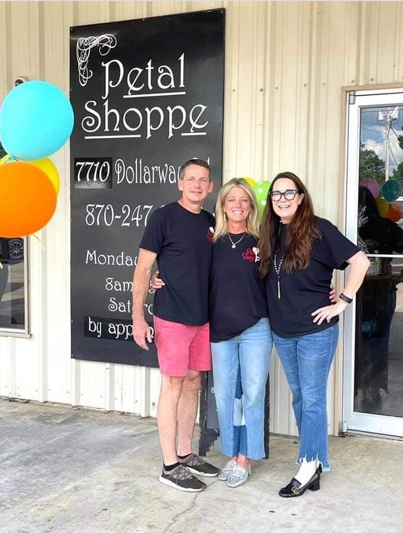 The Petal Shoppe Inc. owners, from left, Mike and Jodie Jolly and Melody Contreras, are shown at their new White Hall location. (Special to The Commercial)