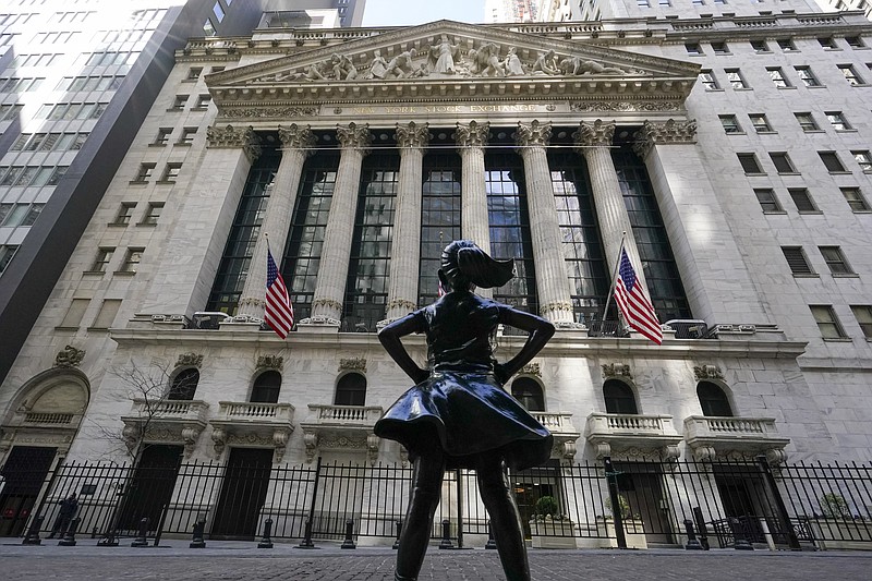 In this March 23, 2021 file photo, the Fearless Girl statue stands in front of the New York Stock Exchange in New York's Financial District. Stocks fell in morning trading Monday, Aug. 16, 2021 amid rising coronavirus infections in the U.S. and around the globe, as well as geopolitical concerns in Asia. (AP Photo/Mary Altaffer, File)