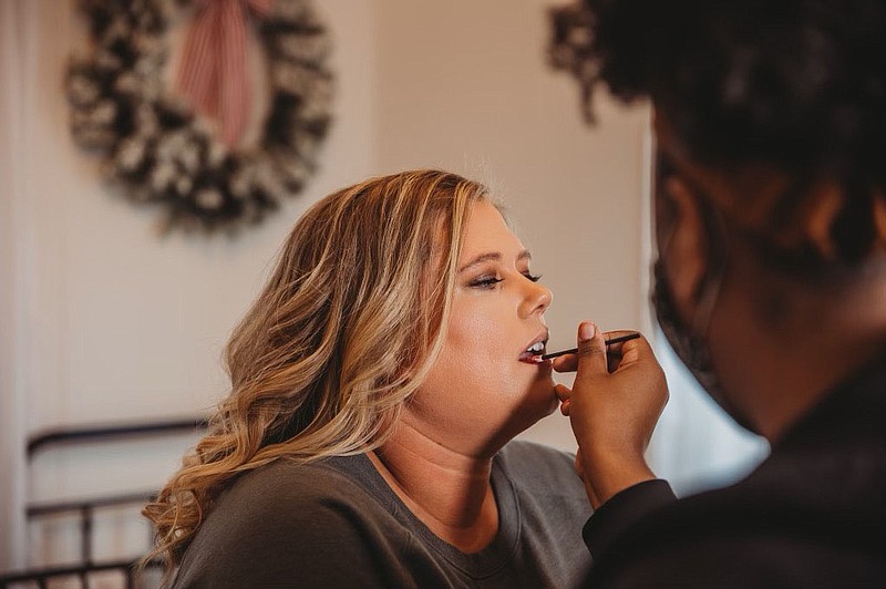 Shae Canaday, owner of The Brushed Beauty Co., does a client’s makeup. Canaday has owned and operated Brushed Beauty since 2017, emerging in Fayetteville as a wedding specialist.

(Courtey Photo/Charlesia Cooke)