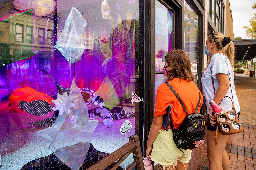 "BRAIN TO BRAIN PAPER PLANE" is interactive. Viewers "are invited to participate in the work through interactive touch-sensors placed on the window glass,” says Kelsey Karper, co-founder of Factory Obscura.
(Courtesy Photo/Downtown Springdale Alliance and Meredith Mashburn)
