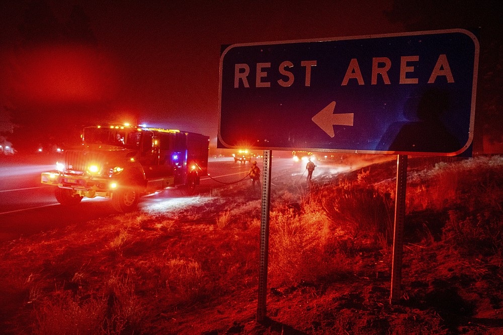 Fueled by winds, largest wildfire moves near California city