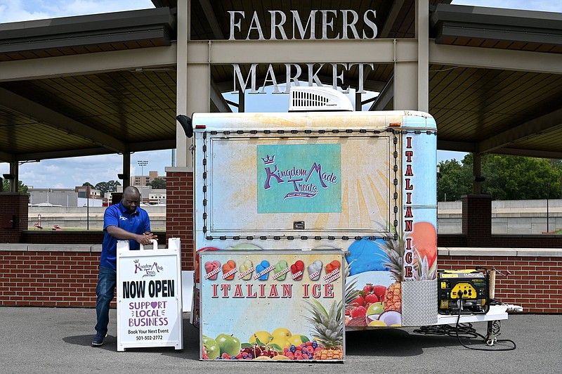 Tim Turner, owner of Kingdom Treats with his wife, Tamkea, sets up his food truck at the Jacksonville Farmers Market on Tuesday, Aug. 17, 2021.

(Arkansas Democrat-Gazette/Stephen Swofford)