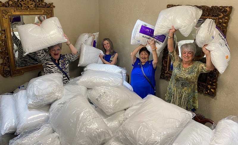 From left, Sharon Stanley Wyatt, governor, DCW, Kay Tatum, president, CD17, Jerrie Jones, president, U.S.D. 1812, and Sheila Beatty-Krout, U.S.D. 1812 veterans state chair, inventory the bonanza of pillows donated. Photo is courtesy of Dot House, Sissy’s Log Cabin. - Submitted photo