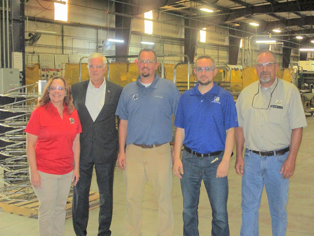 Marc Hayot / Siloam Sunday US Representative Stephen Womack (AR-3 second from left) poses with PR Manager Patti Eiland; President / CEO Grant Loyd; Director of Operations Elton Moore and Director of Quality Assurance Terry Martin Wednesday at the Alternative Design manufacturing facility. Womack visited Alternative Design while visiting small businesses in Northwest Arkansas and spoke with company executives about wages, labor shortages and manufacturing challenges .