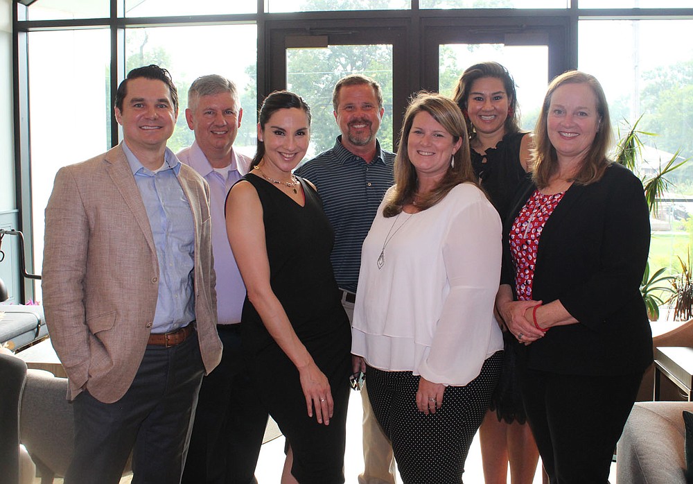 Tyler Buttle (from left), Curtis Stewart, Kathleen Gonzalez, Tom Pickert, Brittany Dunlap, Candice Chang, Deana Bishop gather at the BFF opening reception in Bentonville.
(NWA Democrat-Gazette/Carin Schoppmeyer)