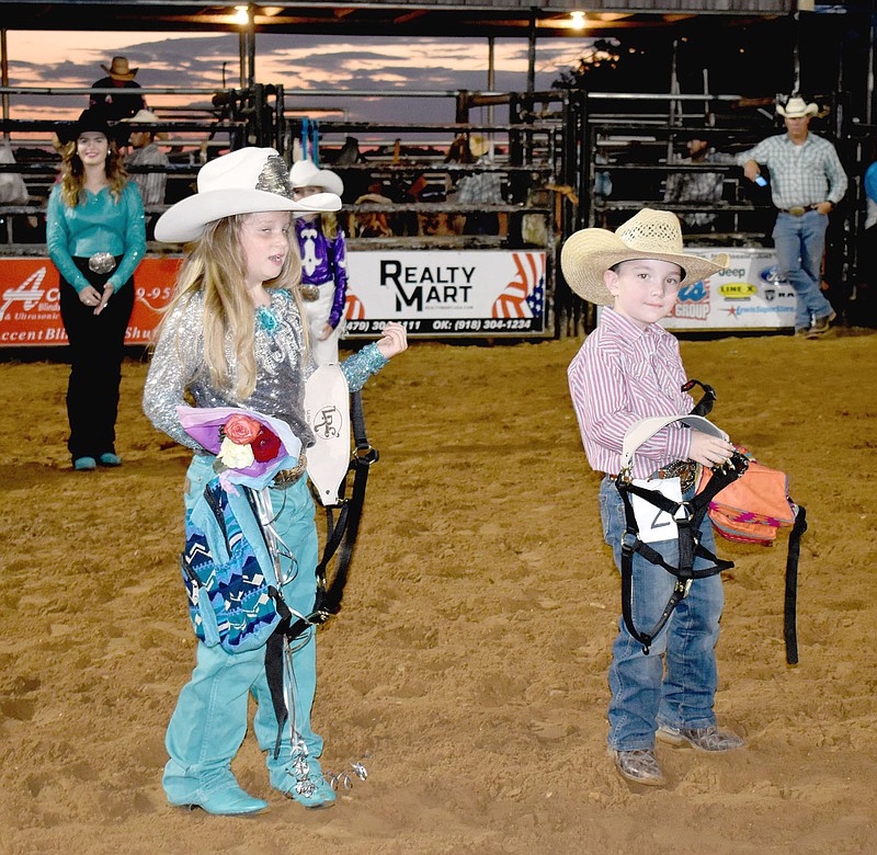 MARK HUMPHREY  ENTERPRISE-LEADER/Mattie Swint (left), 2021 Lincoln Riding Club Lil' Miss and Stockton Smith, 2021 Lil' Mister stepped out into the LRC Arena during Saturday night's final performance of the 68th annual Lincoln Rodeo to receive their titles.