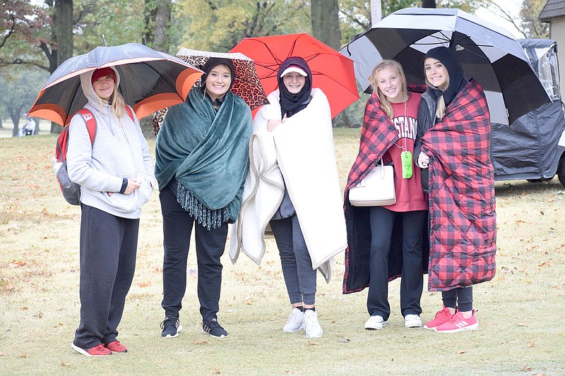 RICK PECK/FILE PHOTO
McDonald County golfers (from left) Fayth Ogden, Jolie Stipp, Kyle Moore, Kelsie Lilly and Lundyn Trudeau braved rainy conditions to root on teammate Lily Allman in the state golf tournament last year.